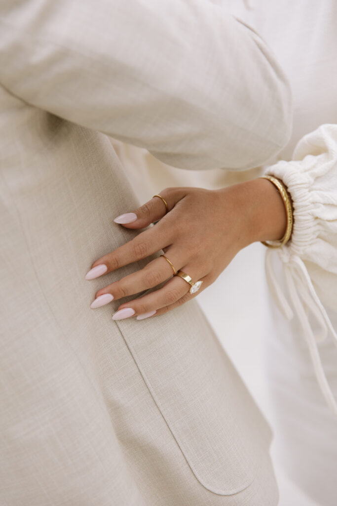 Close-up of engagement ring on bride's hand with Pacific Ocean views from San Clemente beach house proposal
