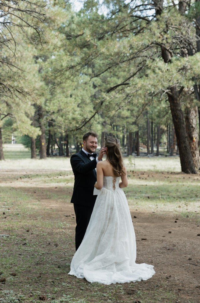 Timeless images of first look at Flagstaff Arizona wedding Nordic Village