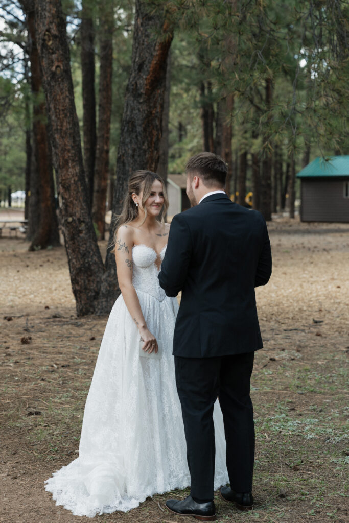 Timeless images of first look at Flagstaff Arizona wedding Nordic Village
