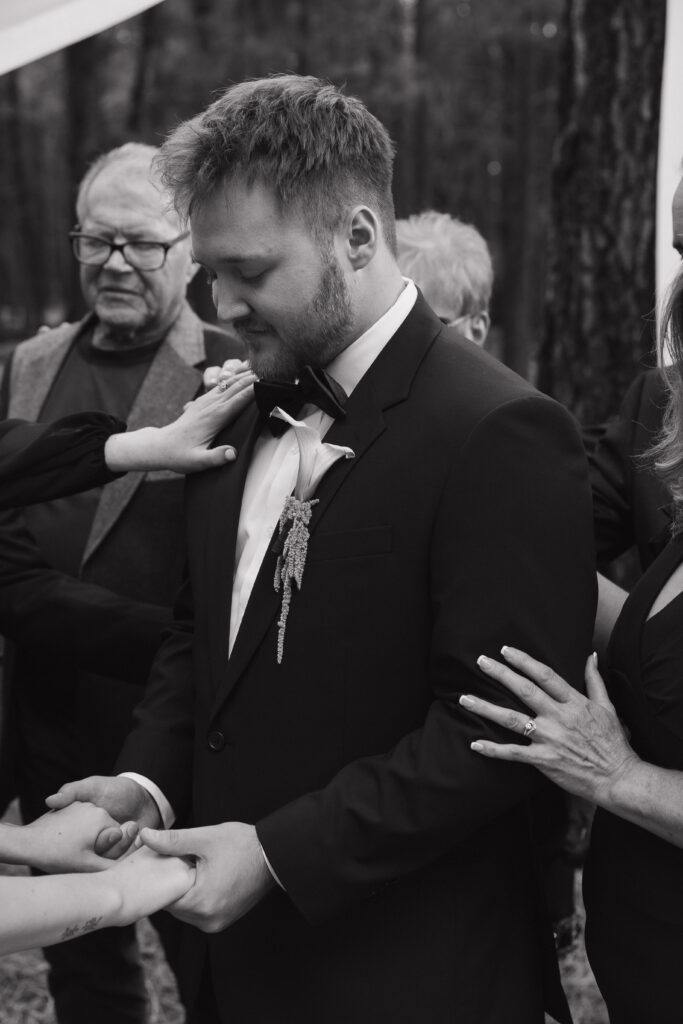 Timeless Flagstaff Arizona wedding ceremony at Nordic Village with intimate family prayer
