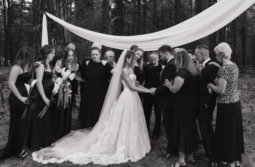 Timeless Flagstaff Arizona wedding ceremony at Nordic Village with intimate family prayer