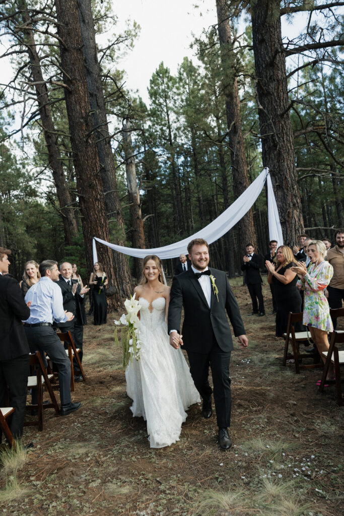 Bride and groom exchanging vows timeless Flagstaff Arizona wedding Nordic Village