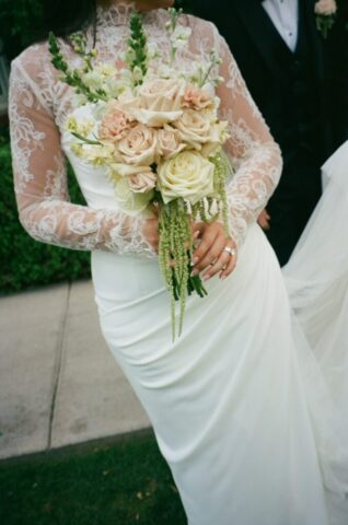 Bride's wedding dress and florals on film