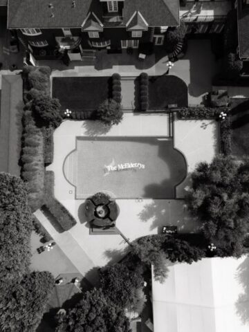 Aerial drone photo of Stonebridge Manor wedding venue Mesa Arizona showing estate gardens and pool