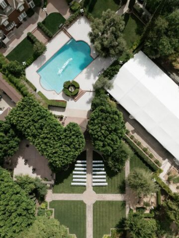 Aerial drone photo of Stonebridge Manor wedding venue Mesa Arizona showing estate gardens and pool